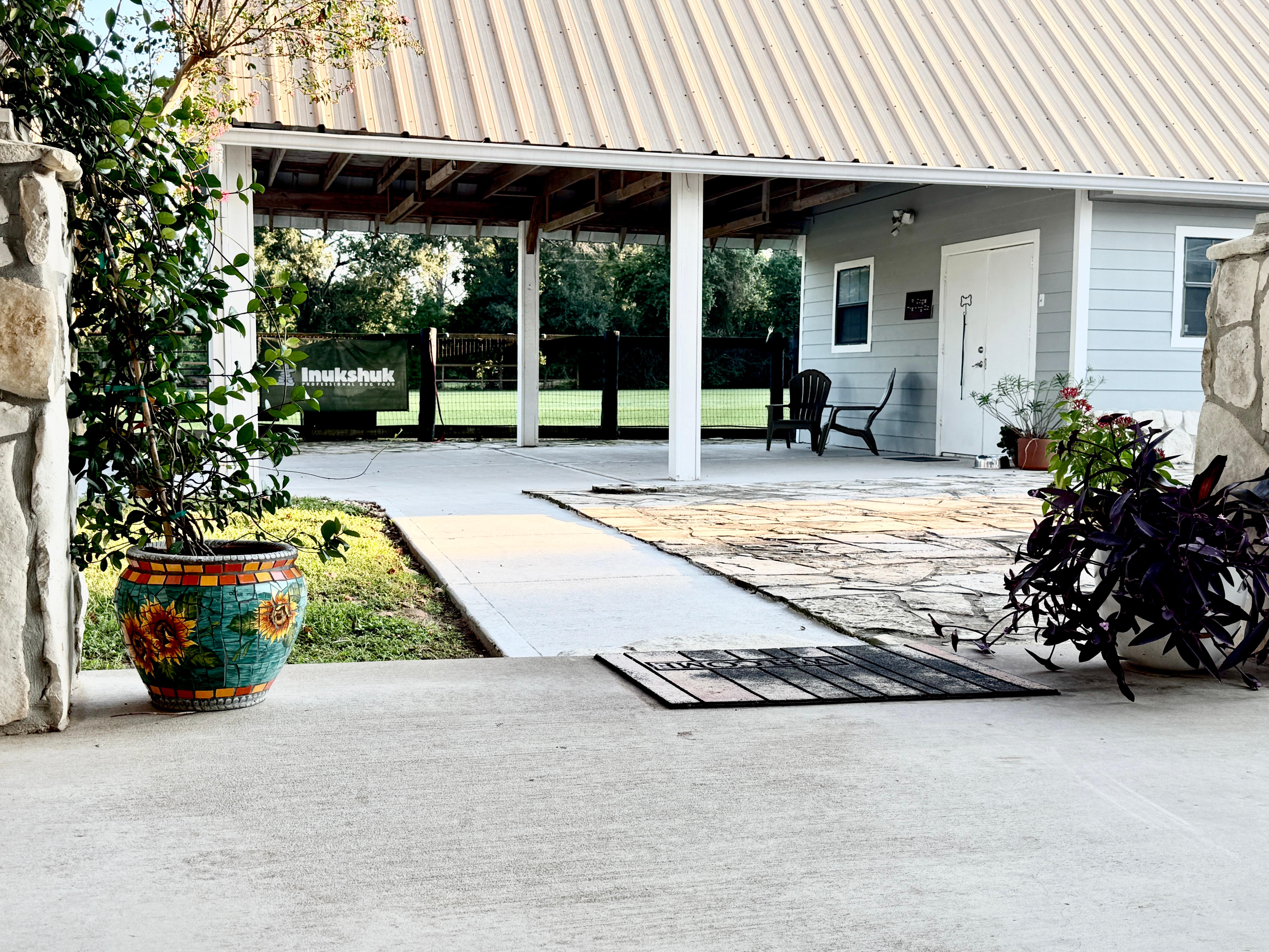 Weather-protected covered training area for year-round dog training programs